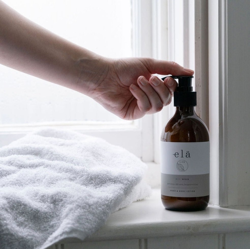 amber glass bottle of lotion in use