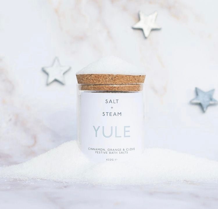 jar of bath salts sitting in a pile of white salt