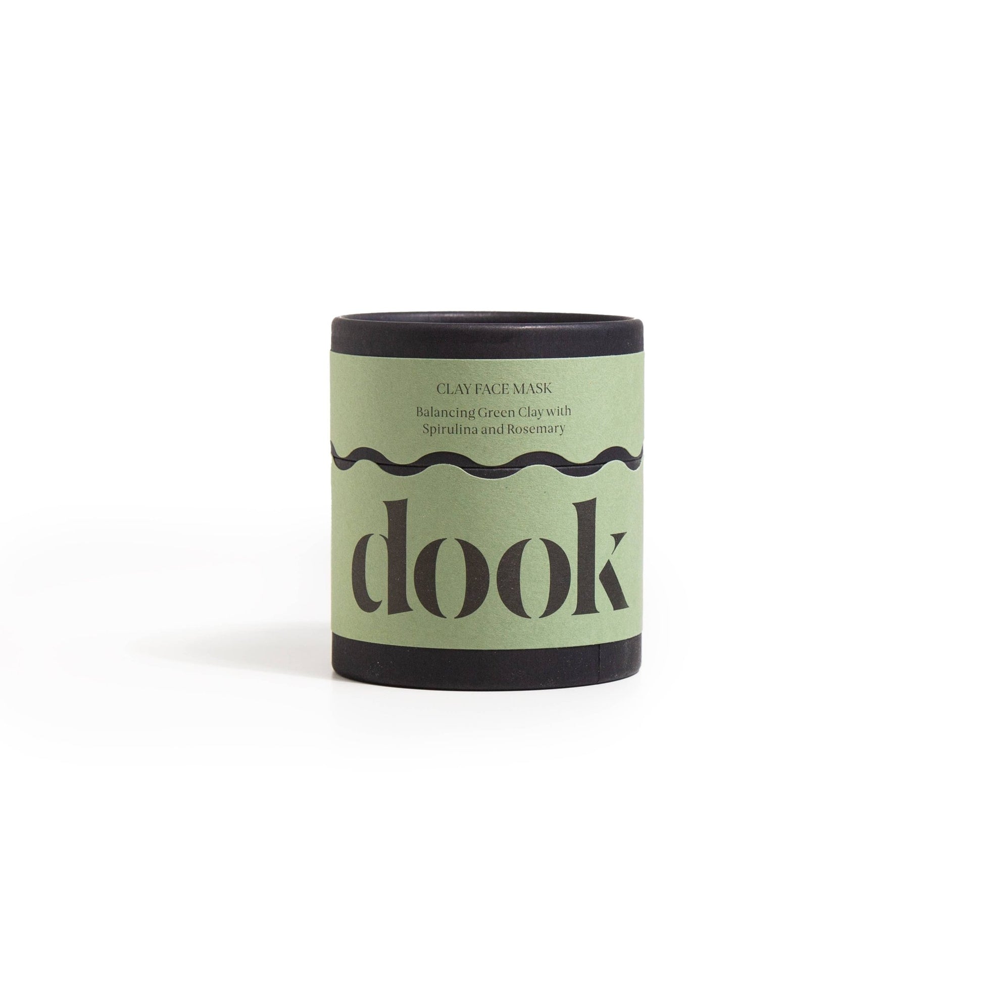 green clay face mask in it's cylinder packaging 