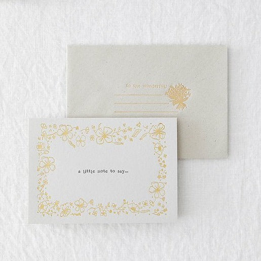 grey card with gold foiling