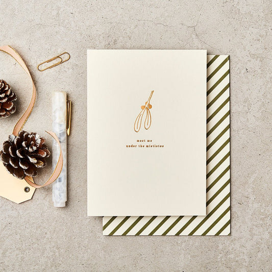 Meet me under the mistletoe Christmas card with gold foil illustration of mistletoe