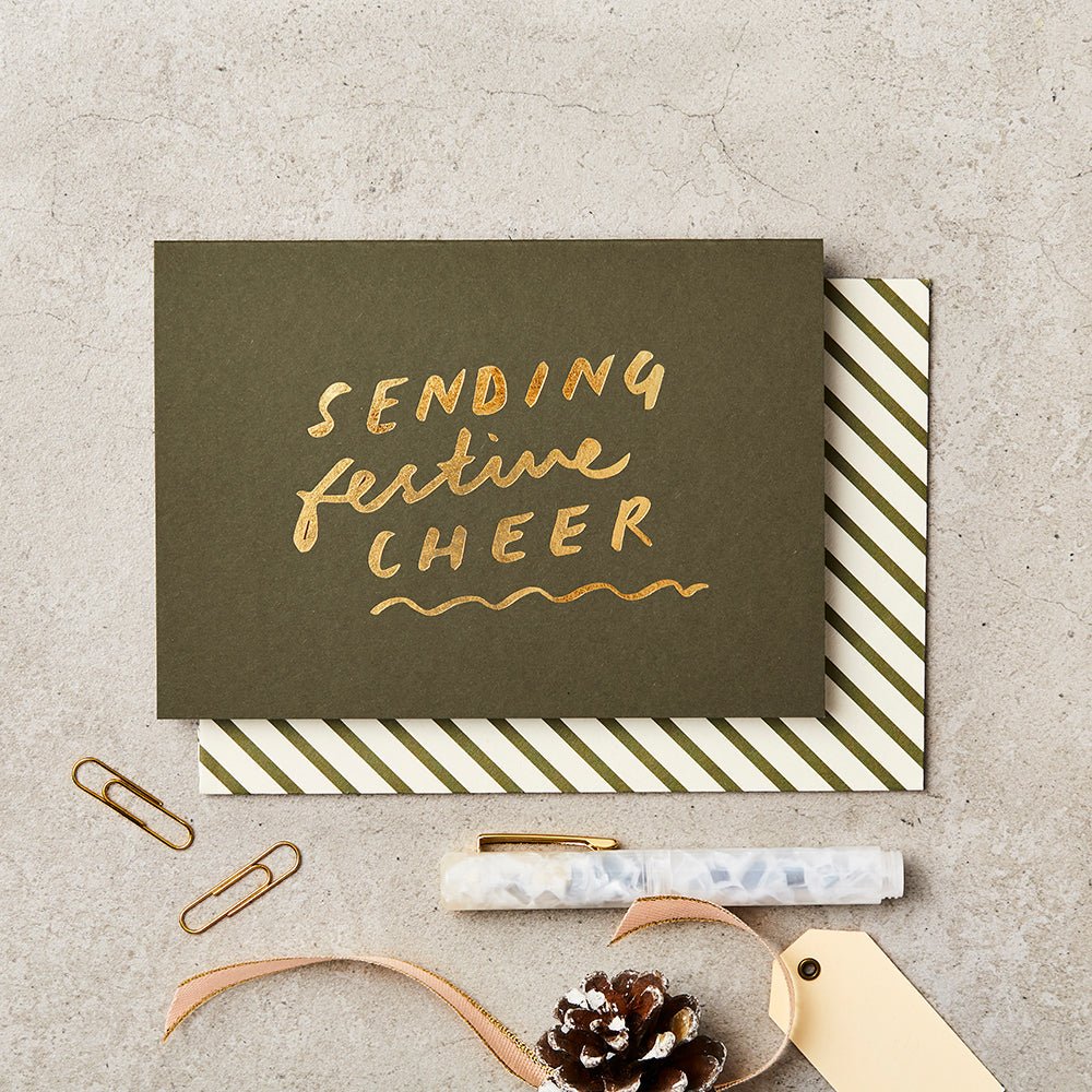 Green Christmas card with gold foil message 'Sending Festive Cheer'