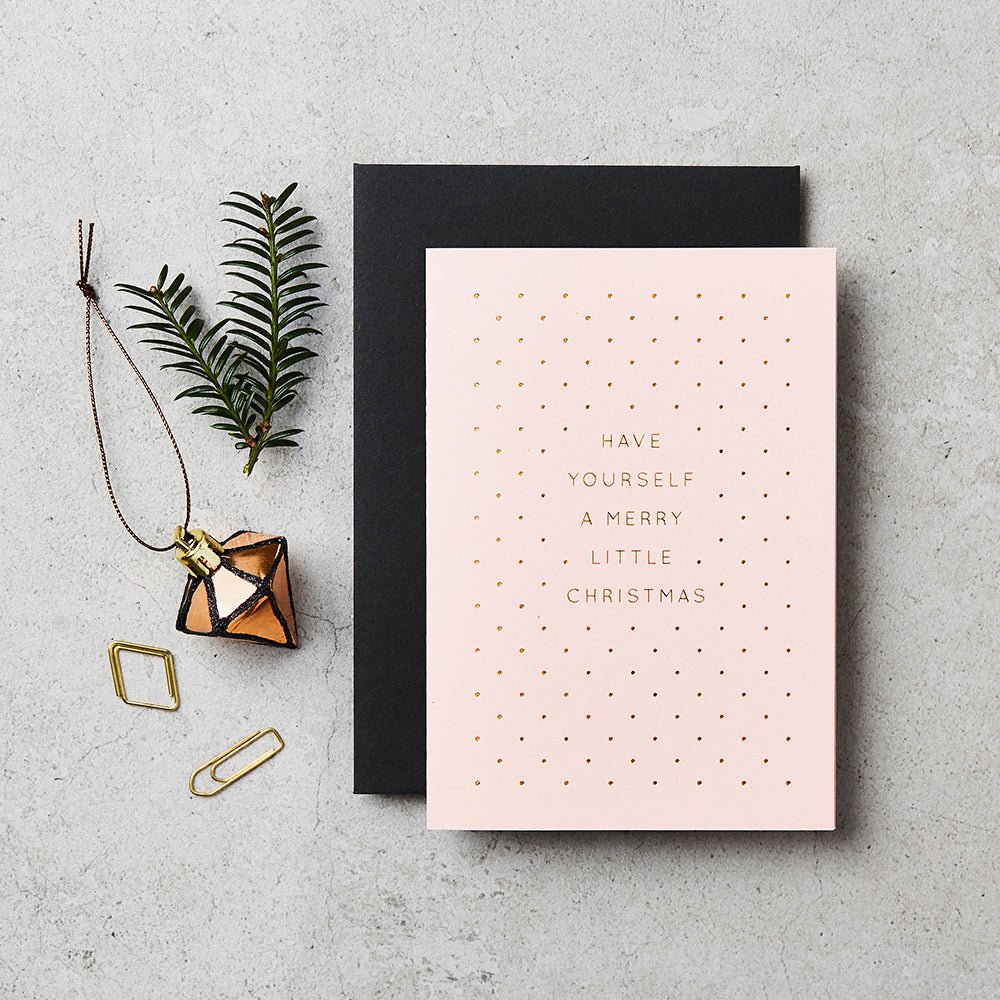 Pink card with gold foiled message 'have yourself a merry little christmas'