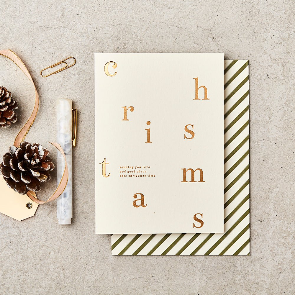 Gold foiled Christmas Card with black and white striped envelope